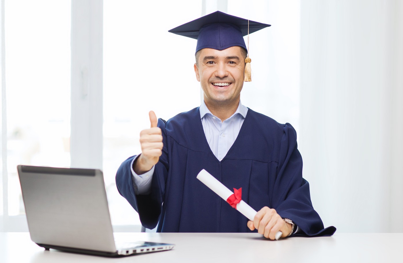 happyadultstudentwithMPWdiploma